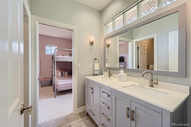 bathroom with double sink vanity and tile patterned flooring