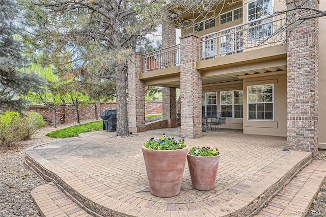 view of patio / terrace with a balcony