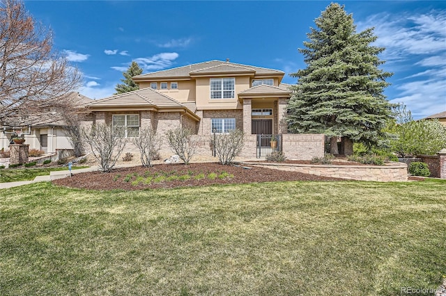 view of front of home featuring a front yard