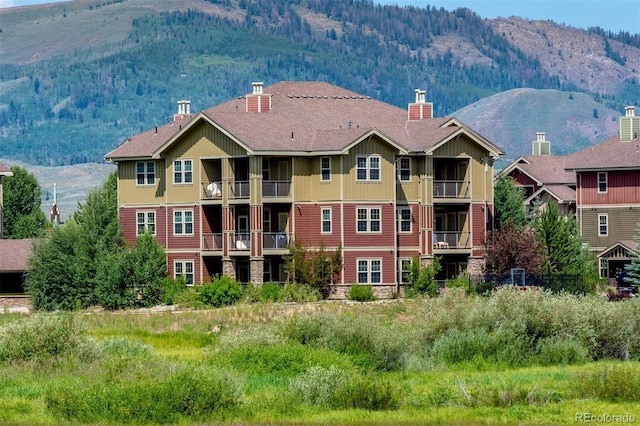 view of building exterior with a mountain view