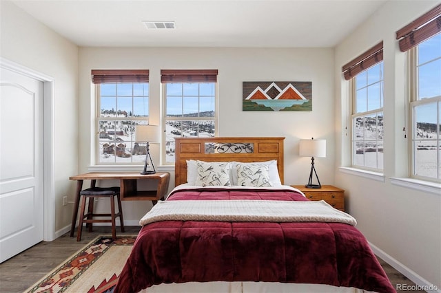 bedroom with wood-type flooring