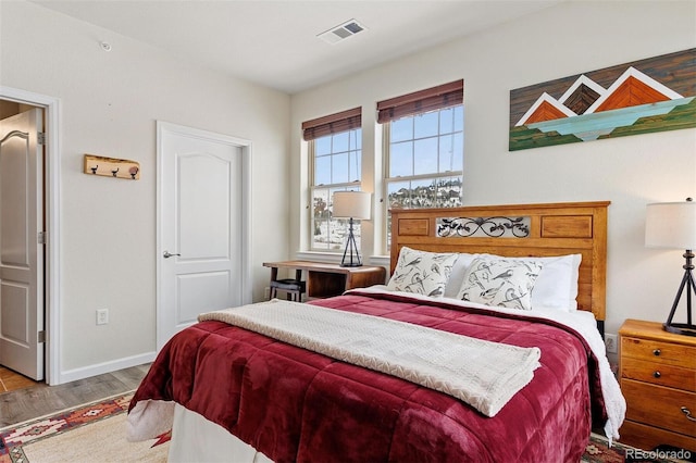 bedroom featuring wood-type flooring