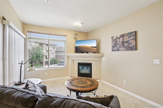 4545 Wheaton Dr Unit B210, Fort Collins, CO 80525 - living area with carpet and a glass covered fireplace