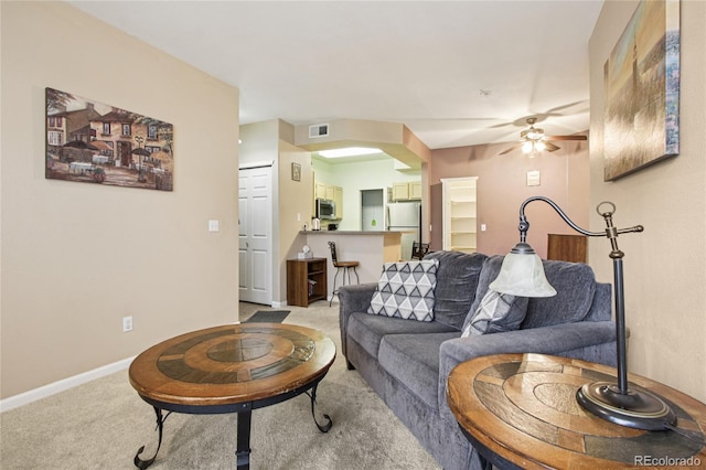 4545 Wheaton Dr Unit B210, Fort Collins, CO 80525 - living area featuring light carpet and a ceiling fan