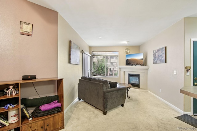 4545 Wheaton Dr Unit B210, Fort Collins, CO 80525 - living area with a glass covered fireplace and carpet flooring