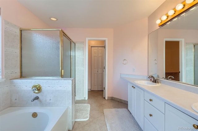 bathroom featuring vanity, tile patterned floors, and shower with separate bathtub