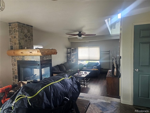 3811 Lisbon Ct, Denver, CO 80249 - living room with ceiling fan, wood-type flooring, and a stone fireplace