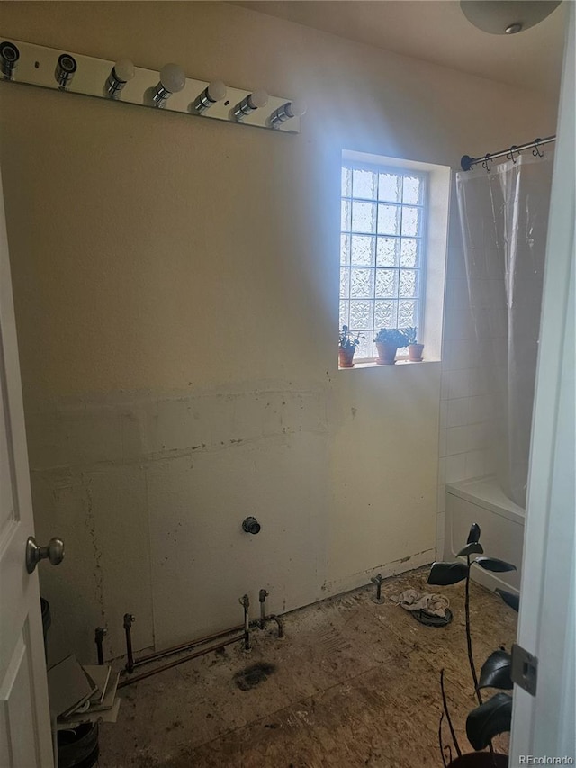 3811 Lisbon Ct, Denver, CO 80249 - full bath featuring a shower with shower curtain and a bathtub