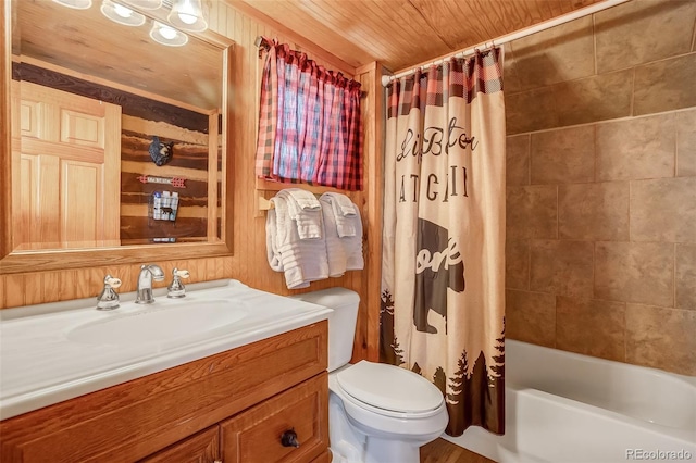 full bathroom with wooden walls, shower / tub combo with curtain, wooden ceiling, vanity, and toilet