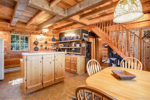 kitchen with wood ceiling, beamed ceiling, a center island, light brown cabinets, and baseboard heating