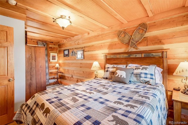 bedroom with wood walls