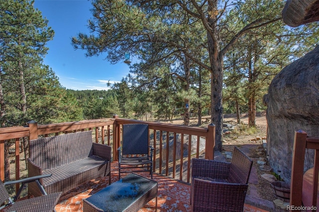 wooden deck with an outdoor living space