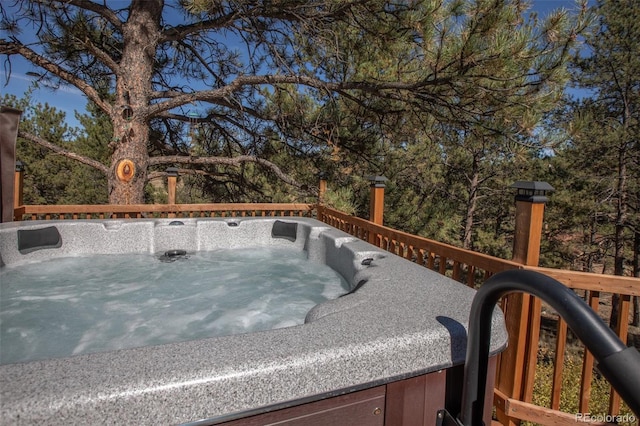 view of swimming pool featuring a hot tub