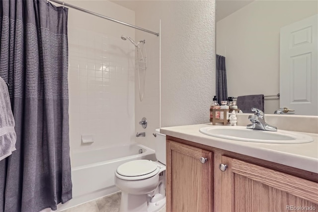 full bathroom featuring shower / tub combo, vanity, tile patterned flooring, and toilet