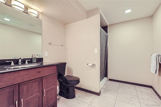 bathroom with tile patterned flooring, vanity, toilet, a textured ceiling, and a shower with curtain