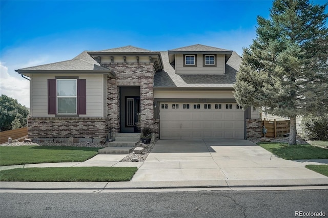 view of front facade featuring a garage and a front lawn