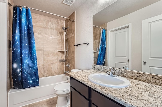 3611 S Perth Cir Unit 103, Aurora, CO 80013 - bathroom featuring vanity, shower / tub combo, tile patterned floors, and a textured ceiling