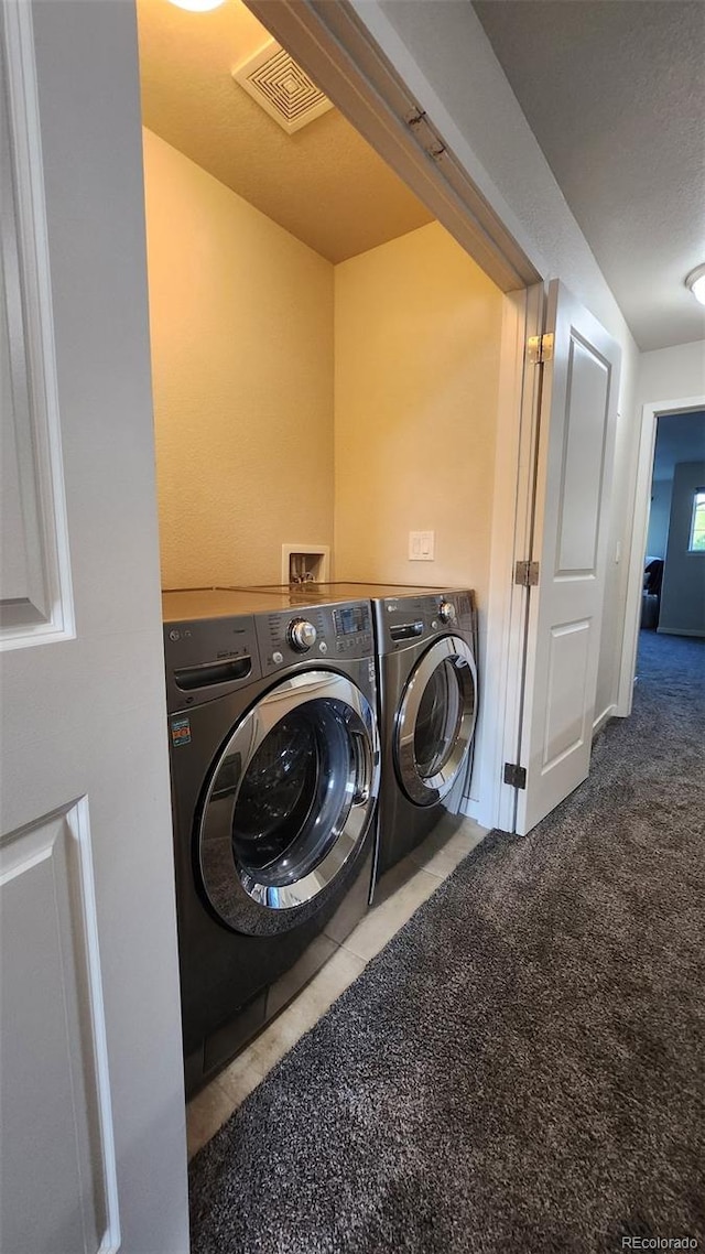 3611 S Perth Cir Unit 103, Aurora, CO 80013 - washroom featuring independent washer and dryer, carpet floors, and tile patterned flooring