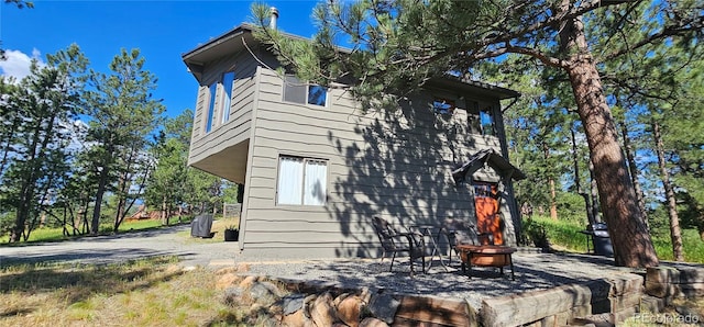 27901 Pine Dr, Evergreen, CO 80439 - view of side of home featuring a fire pit