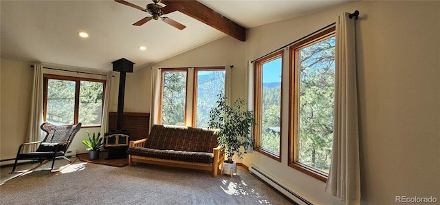 27901 Pine Dr, Evergreen, CO 80439 - living area with a wood stove, ceiling fan, recessed lighting, carpet, and a baseboard radiator