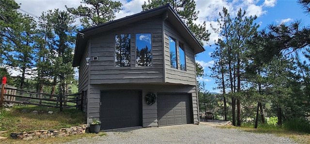 27901 Pine Dr, Evergreen, CO 80439 - view of property exterior featuring driveway and an attached garage