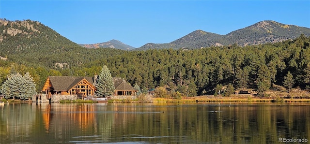 27901 Pine Dr, Evergreen, CO 80439 - view of mountain background with a heavily wooded area and a nearby body of water