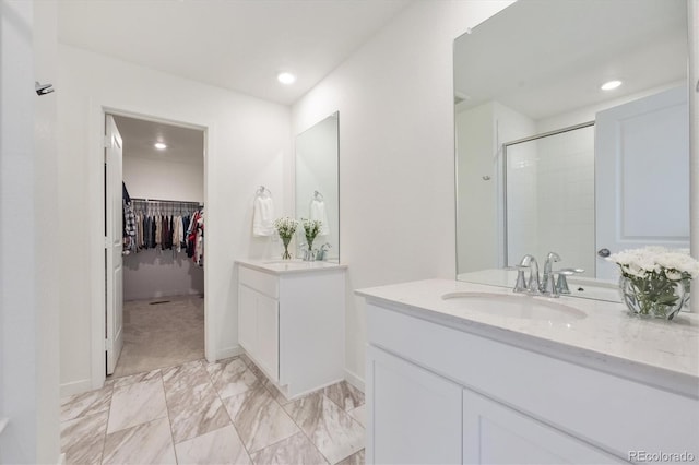 bathroom featuring vanity and walk in shower