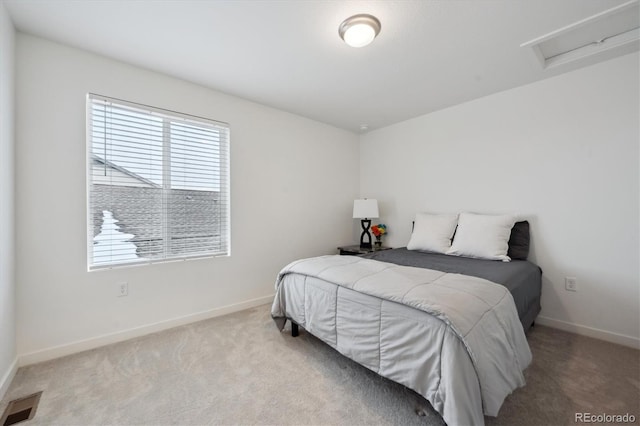 bedroom with light colored carpet