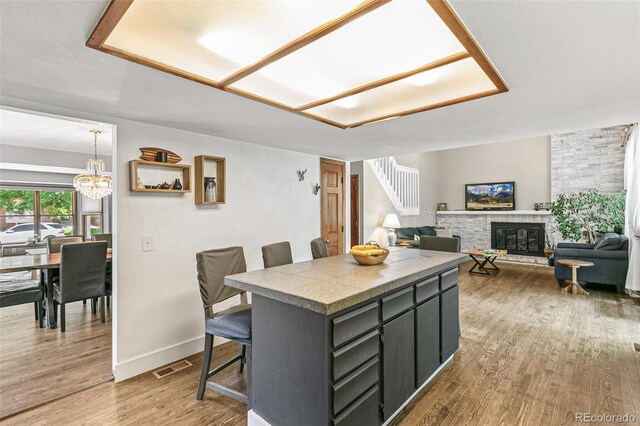 dining room with a chandelier and wood-type flooring