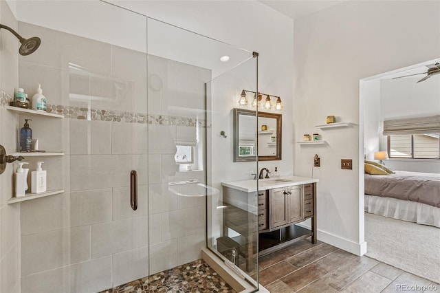 bathroom featuring vanity and an enclosed shower