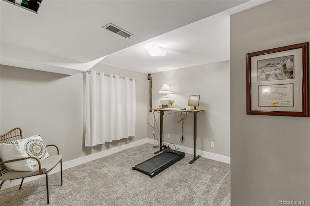 exercise room with light carpet