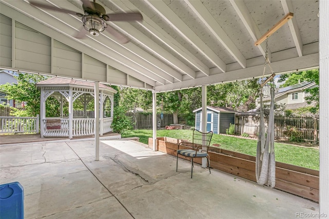 unfurnished sunroom with plenty of natural light, ceiling fan, and lofted ceiling