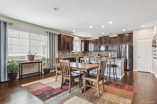 dining space featuring baseboards, dark wood-style floors, recessed lighting, and a textured ceiling