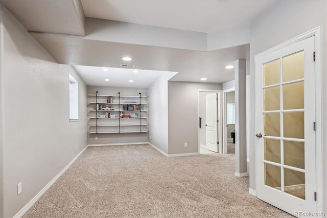 carpeted empty room with baseboards, recessed lighting, and visible vents