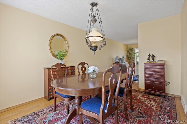 2608 E Fremont Pl, Centennial, CO 80122 - dining area with wood finished floors and a textured ceiling