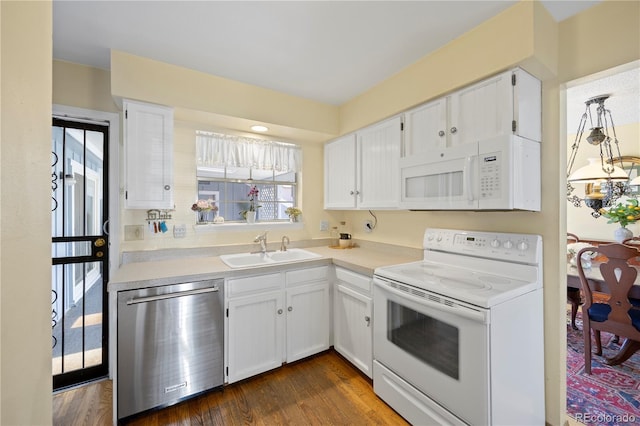 2608 E Fremont Pl, Centennial, CO 80122 - kitchen with white appliances, a sink, white cabinetry, and light countertops