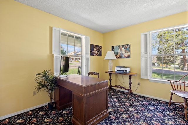 2608 E Fremont Pl, Centennial, CO 80122 - carpeted home office featuring a textured ceiling and baseboards