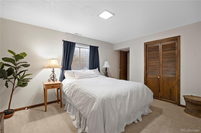 2608 E Fremont Pl, Centennial, CO 80122 - bedroom featuring light colored carpet, a closet, and baseboards