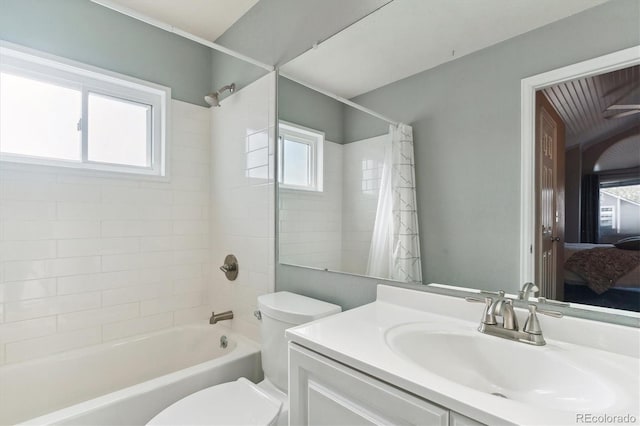 full bathroom with vanity, toilet, and shower / bath combo with shower curtain