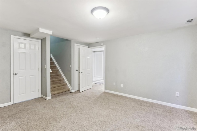 interior space featuring light colored carpet