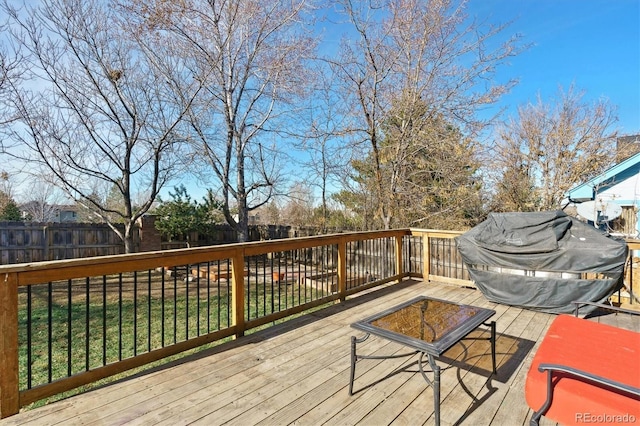 deck with a yard and grilling area