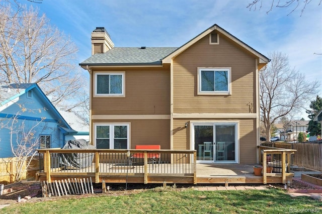 back of house featuring a deck