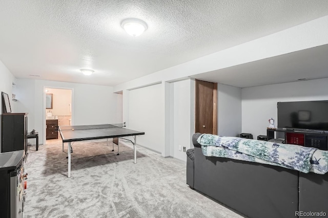 11759 E Asbury Ave, Aurora, CO 80014 - rec room with carpet floors and a textured ceiling