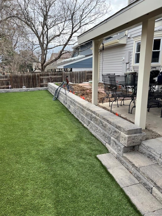11759 E Asbury Ave, Aurora, CO 80014 - fenced backyard featuring a patio area