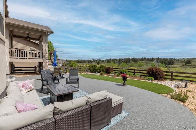 view of patio featuring an outdoor living space and stairway