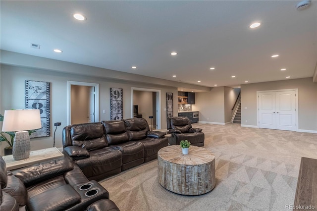 living area with recessed lighting, light colored carpet, stairway, bar, and baseboards