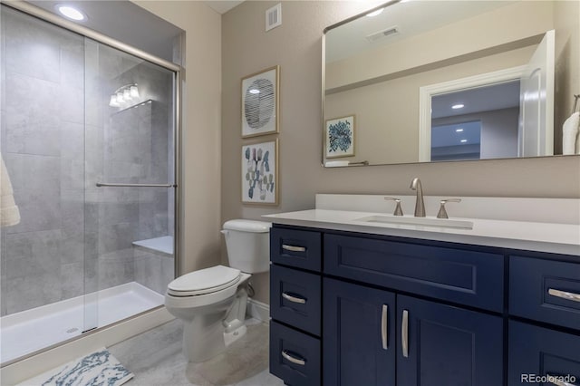 full bath featuring toilet, a stall shower, vanity, and tile patterned floors