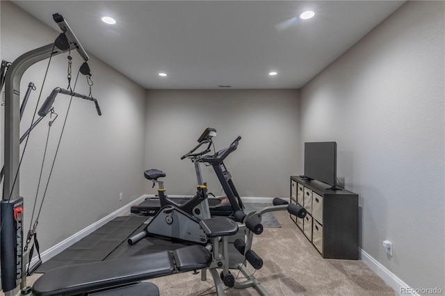 workout area featuring recessed lighting, baseboards, and carpet flooring