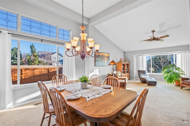 dining room featuring high vaulted ceiling, carpet, visible vents, and ceiling fan with notable chandelier