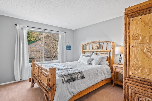 bedroom featuring a textured ceiling, baseboards, and carpet floors